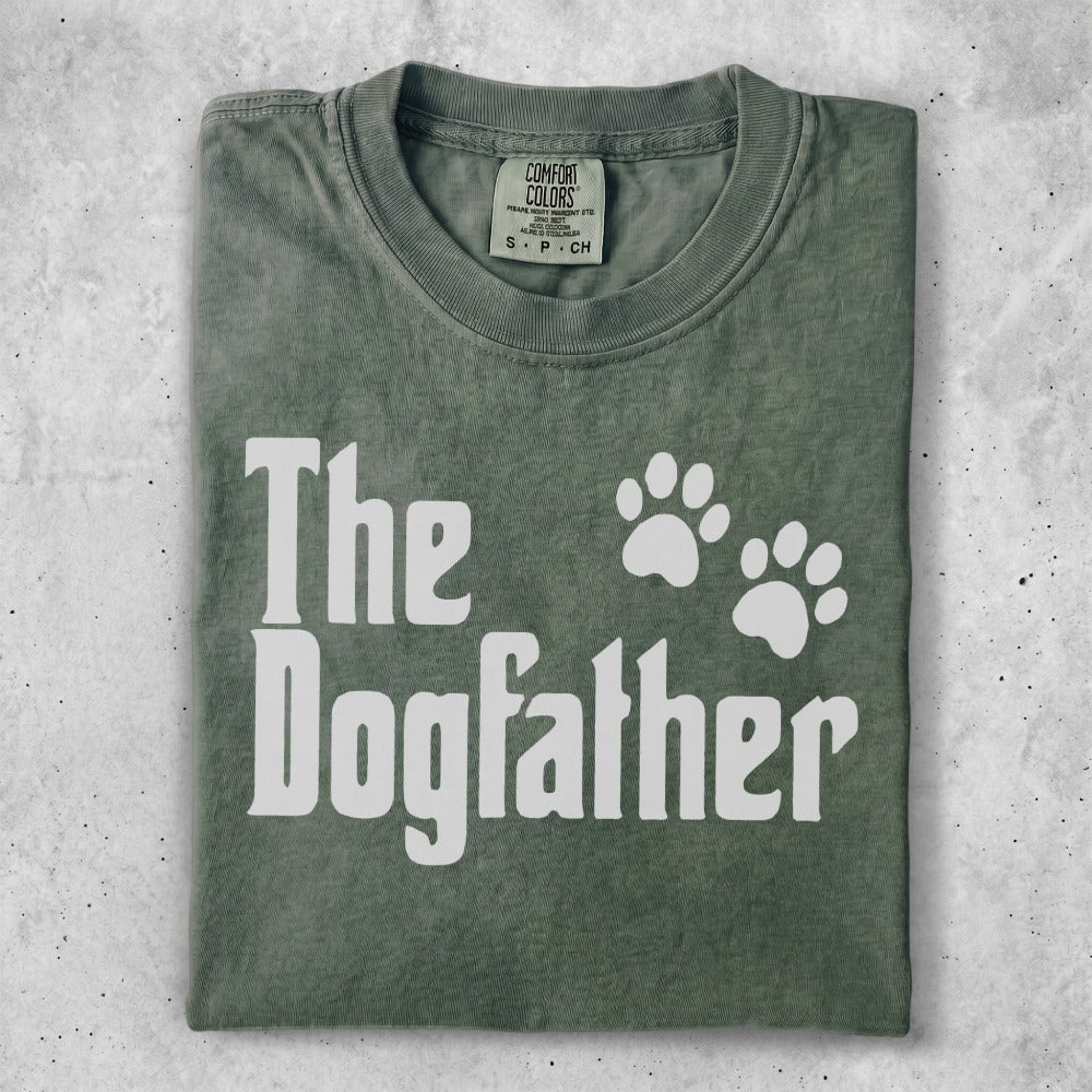 Green t-shirt with "The Dogfather" text and paw prints.