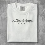Comfort Colors white t-shirt with "coffee & dogs." text and paw prints.