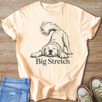 Peach t-shirt with sketch of dog stretching and text "Big Stretch".