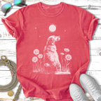 T-shirt with a white dog sitting among daisies and a sun/moon graphic.