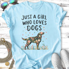 Light blue t-shirt with a floral dog silhouette and text.