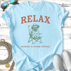 Light blue t-shirt with a pug wearing a hat sitting in a chair, text "RELAX NOTHING IS UNDER CONTROL".