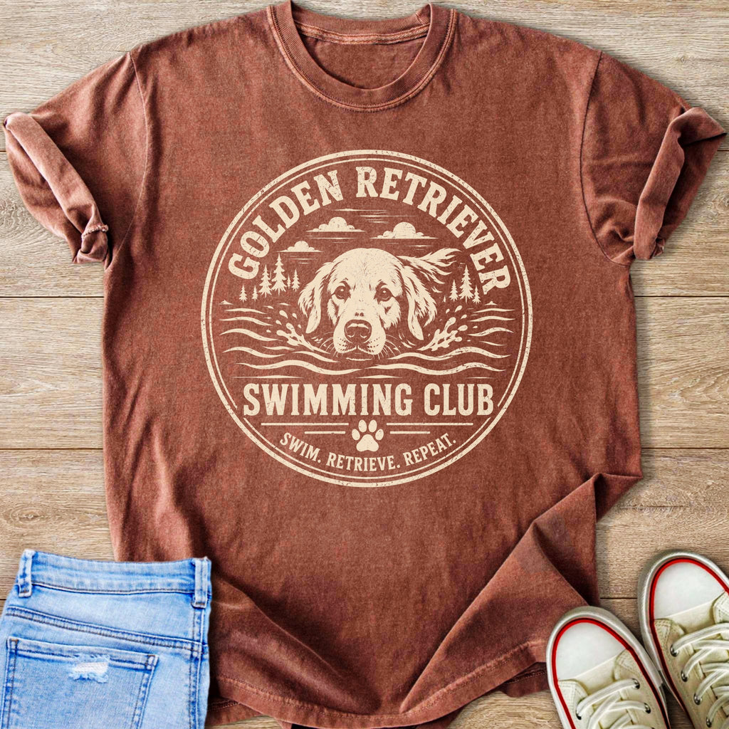 Golden Retriever swimming club graphic on a reddish brown t-shirt with text.
