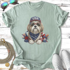 Shih Tzu wearing USA hat and bandana with sunglasses, embellished with feathers.
