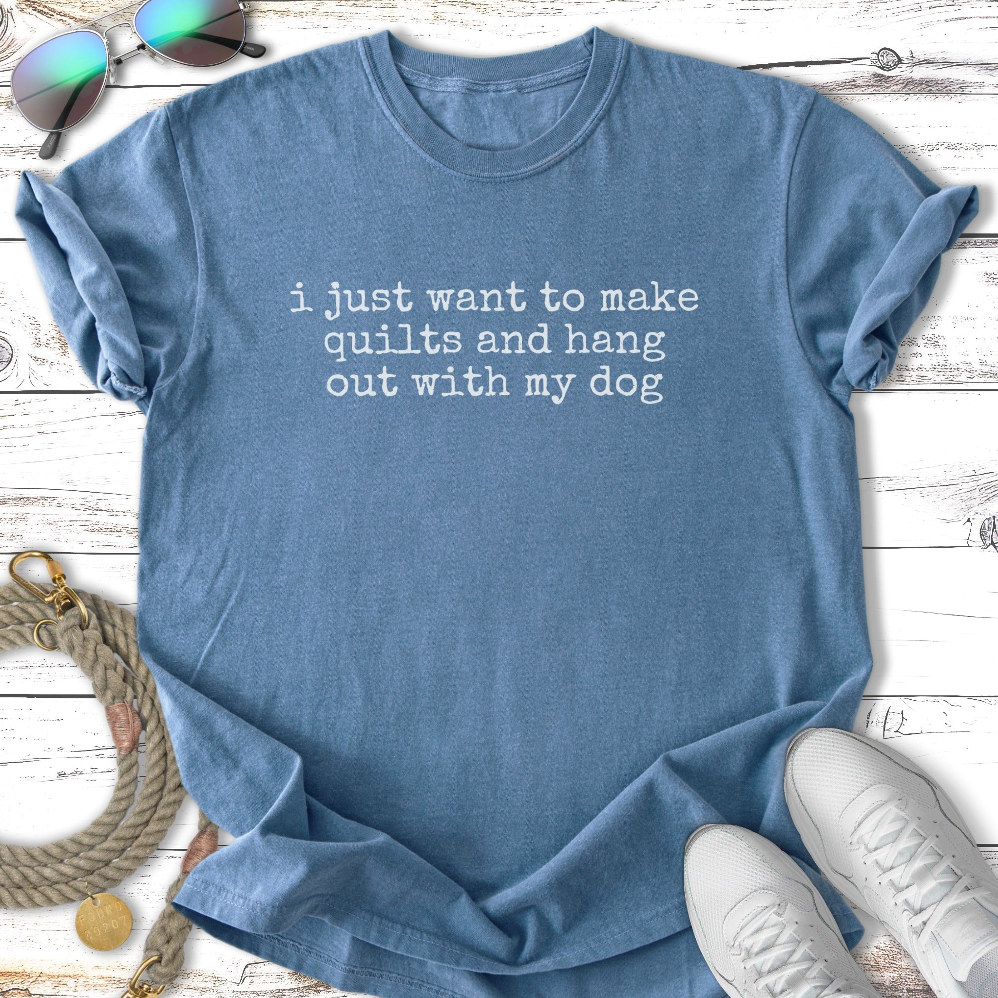 Blue t-shirt with "I just want to make quilts and hang out with my dog" text.