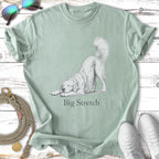 Light green t-shirt with a sketch of a dog in a big stretch pose.