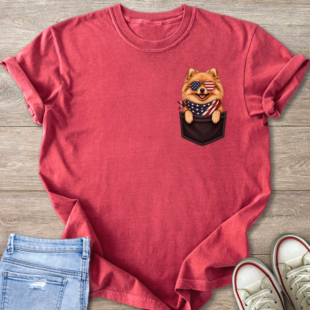 Red t-shirt with a Pomeranian dog in a pocket wearing sunglasses and a bandana.