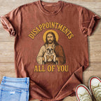 T-shirt with Jesus holding a French bulldog and text "DISAPPOINTMENTS ALL OF YOU."