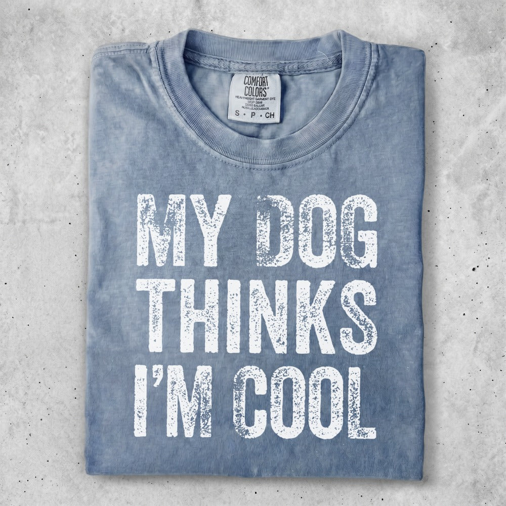 Blue t-shirt with white text "MY DOG THINKS I'M COOL".