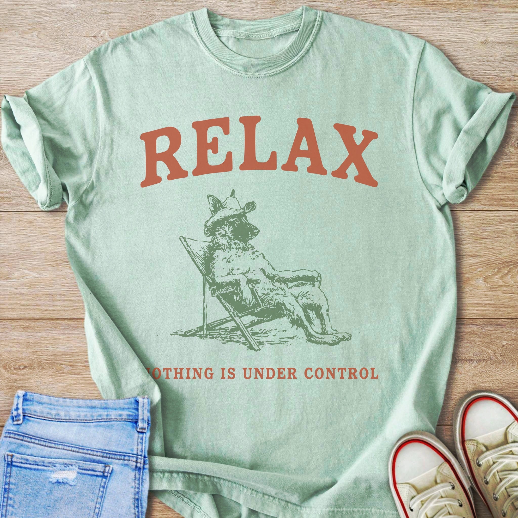 Mint t-shirt with "RELAX" graphic and text "NOTHING IS UNDER CONTROL"