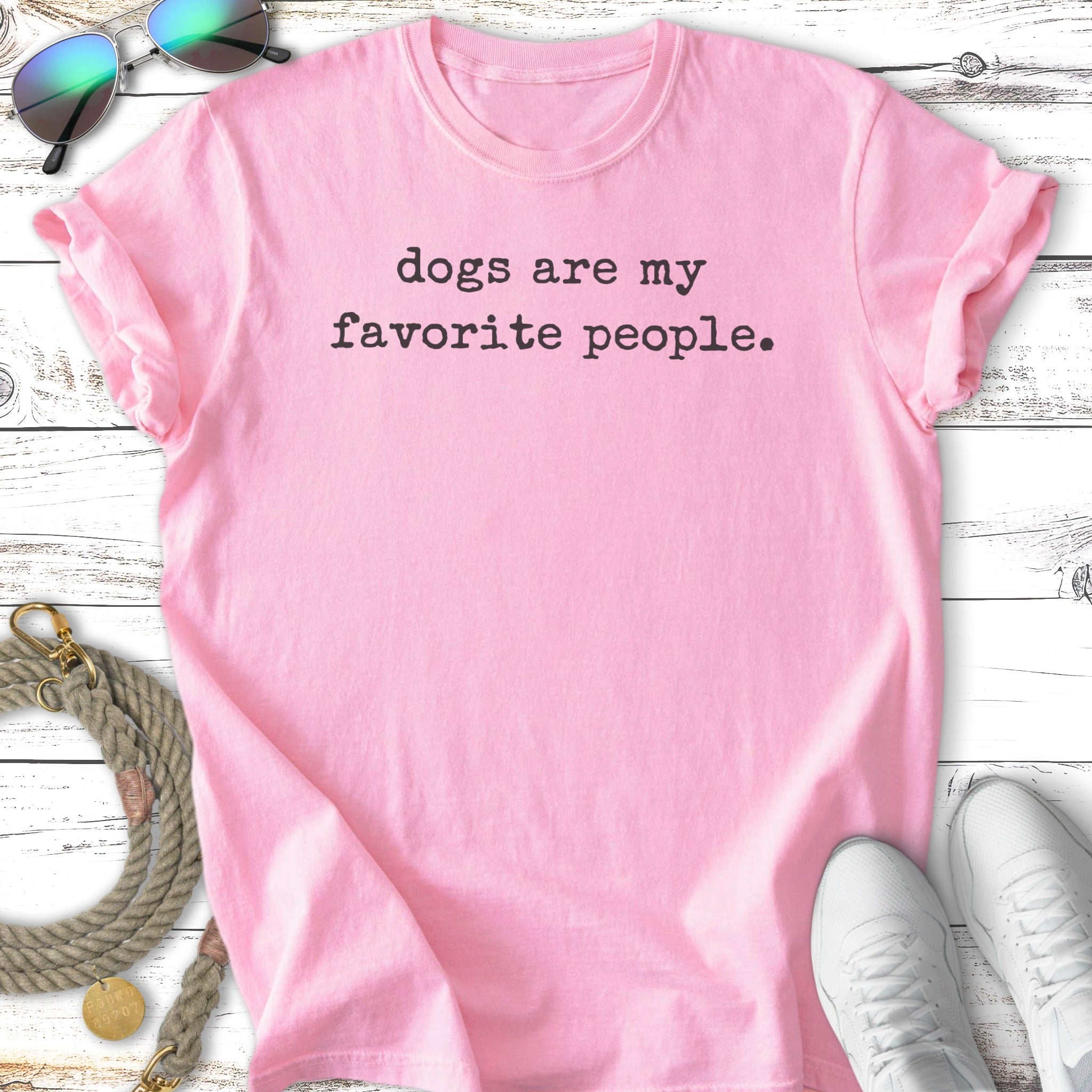 Pink t-shirt with "dogs are my favorite people" text.