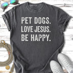 Dark gray t-shirt with "PET DOGS. LOVE JESUS. BE HAPPY." text.