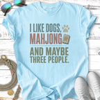 Light blue t-shirt with "I like dogs, mahjong and maybe three people" text.