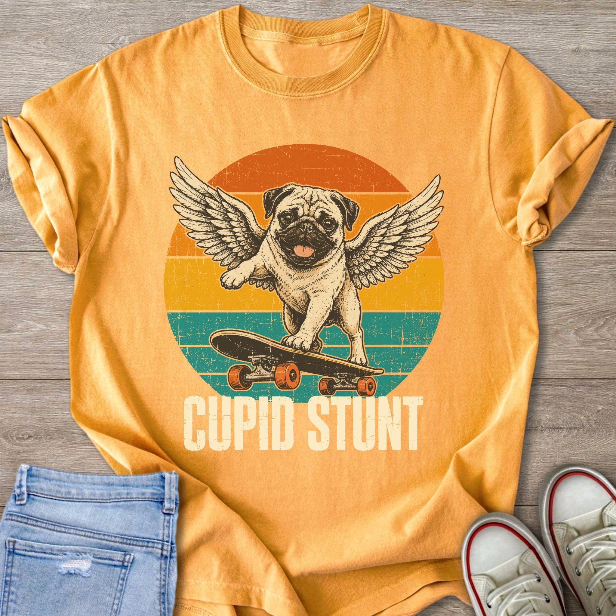 A pug with wings on a skateboard reads "Cupid Stunt" on a sunset background.