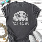 Dark t-shirt with "Yes, I Herd You" and an Australian Shepherd dog illustration.