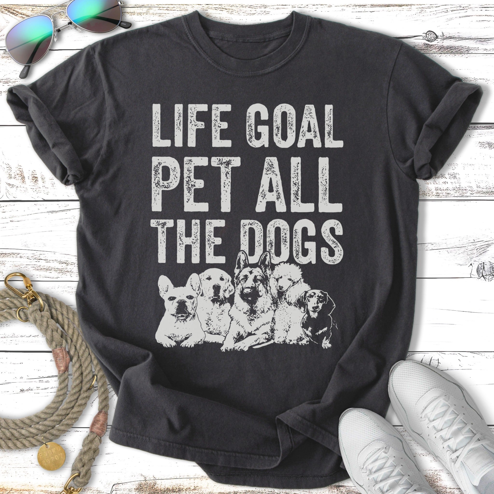 Dark t-shirt with "Life Goal Pet All The Dogs" and illustrations of five dogs.