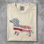 Cream t-shirt with a dachshund silhouette filled with American flag pattern.