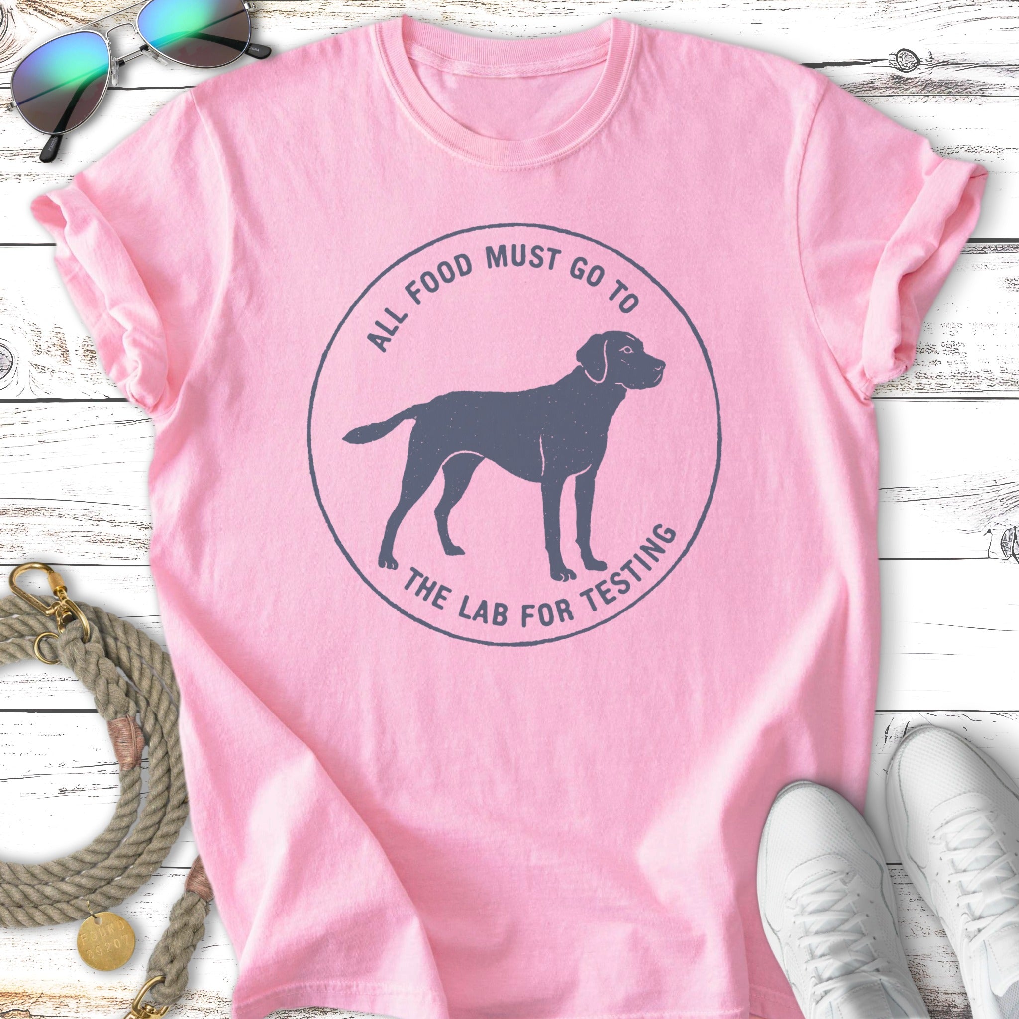 Pink t-shirt with dark gray graphic of a Labrador and text.
