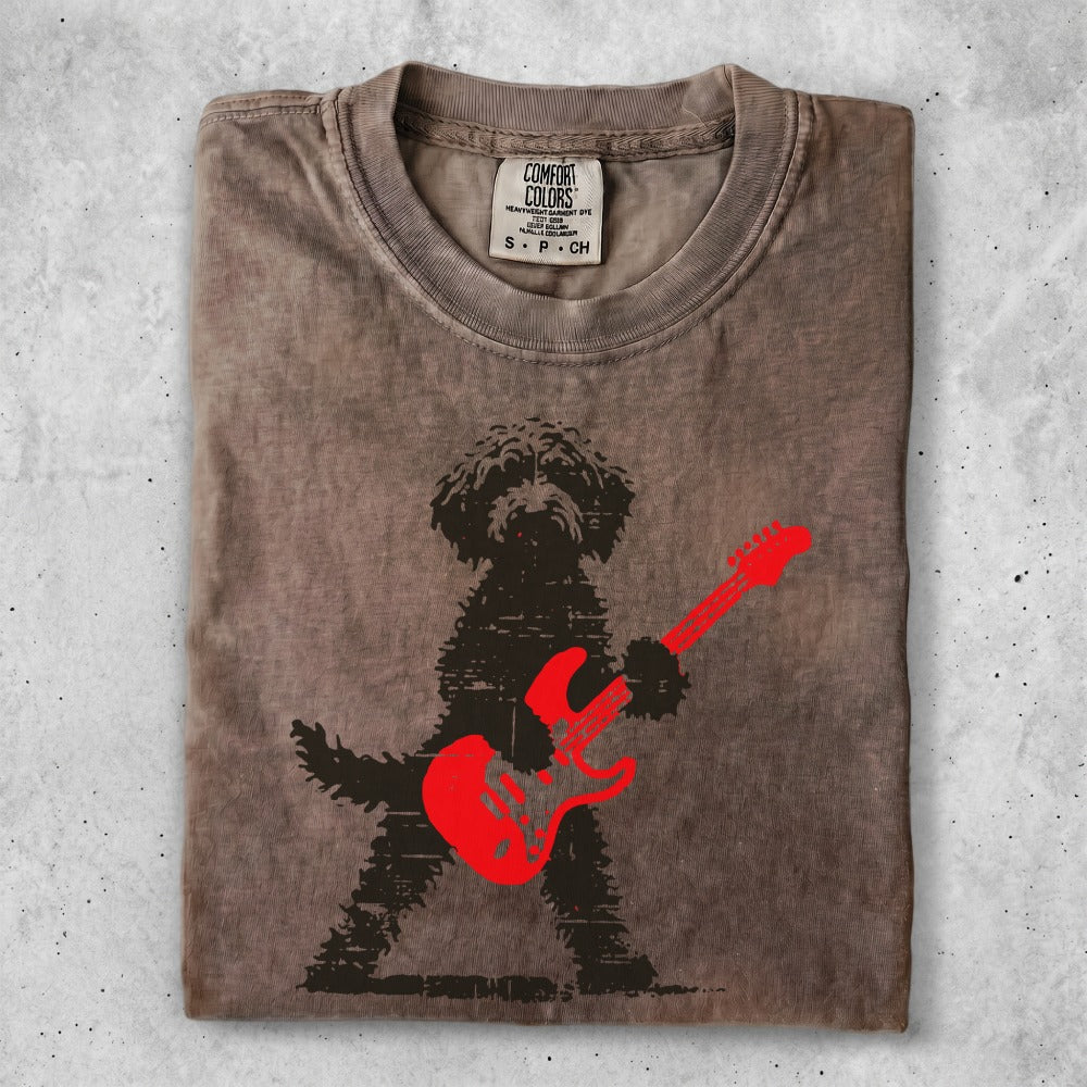 Brown t-shirt with a black silhouette of a dog playing a red electric guitar.