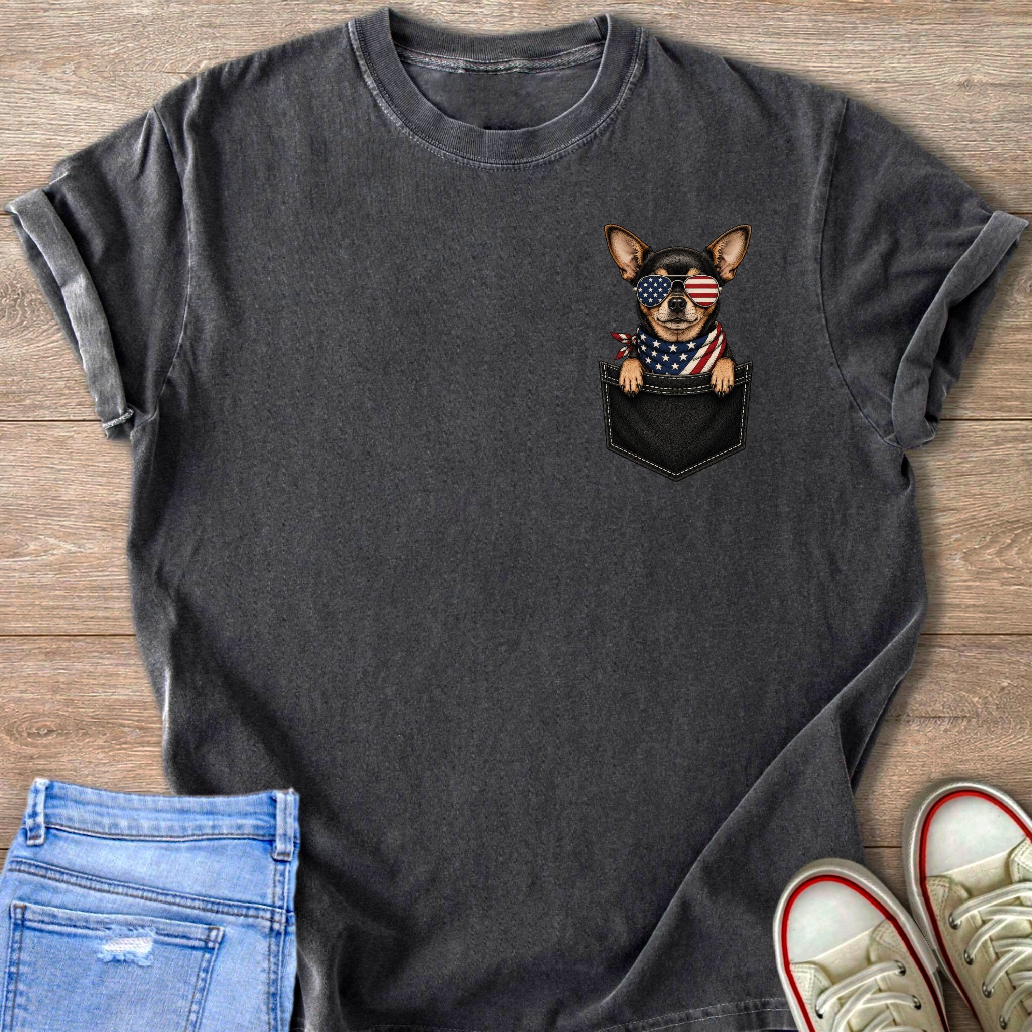 Charcoal t-shirt with a graphic of a chihuahua in a pocket wearing patriotic sunglasses and bandana.