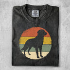 Black dog silhouette on a vintage-style sunset circle design.