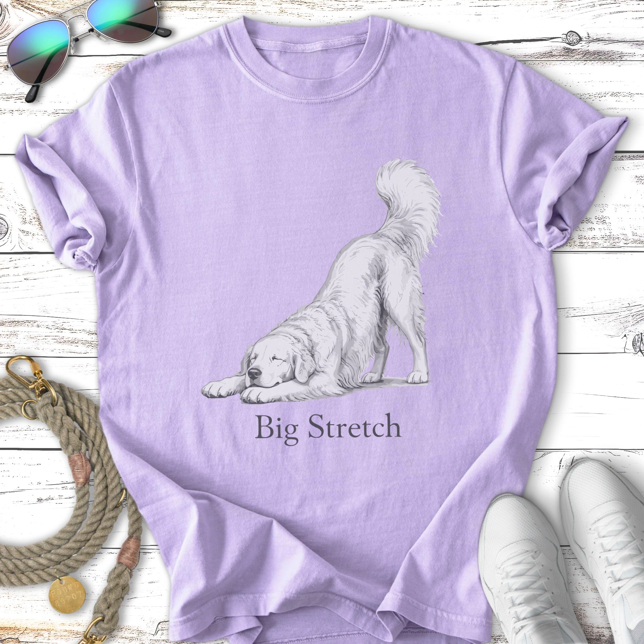 Illustration of a white dog doing a "Big Stretch" on a lavender t-shirt.