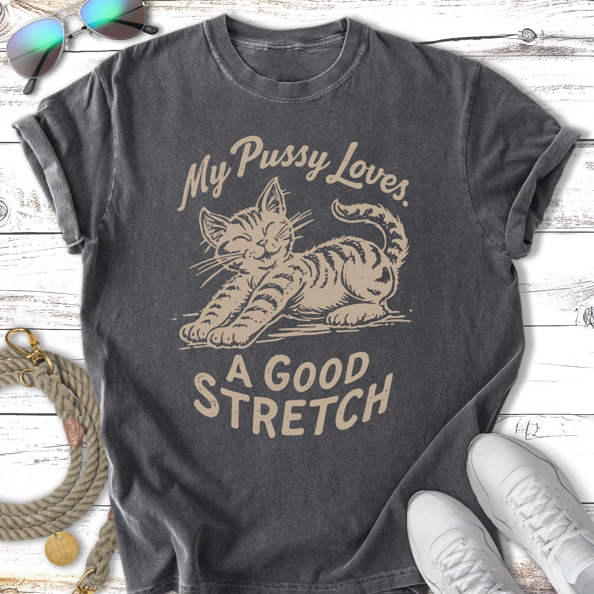 Cat stretching with text "My Pussy Loves A Good Stretch" on vintage t-shirt.