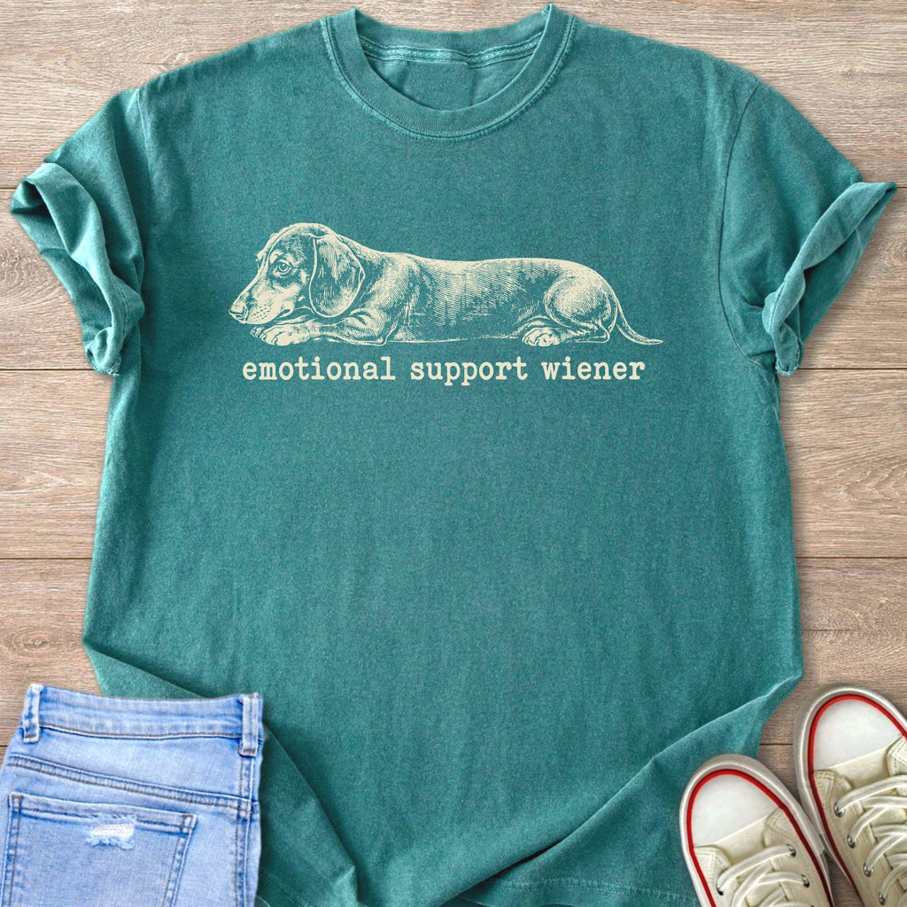 Teal t-shirt with a sketch of a dachshund and text "emotional support wiener".