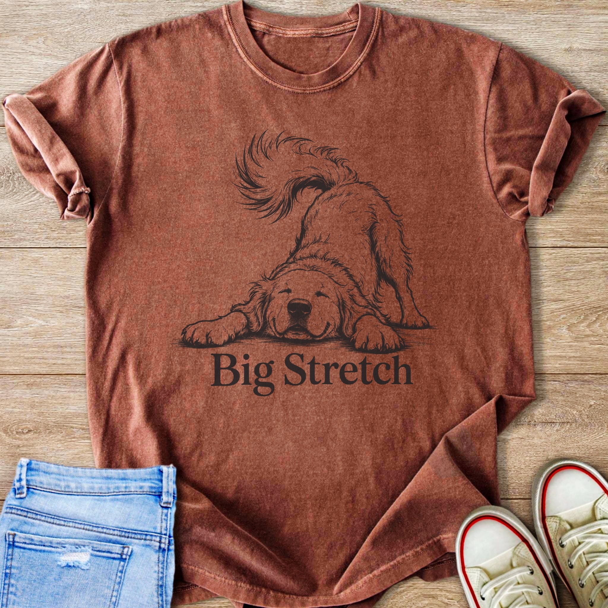 Brown t-shirt with a sketched dog and "Big Stretch" text.