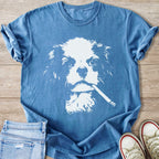 Blue t-shirt with white graphic of a dog's face holding a cigarette.