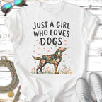 White t-shirt with "Just a girl who loves dogs" and floral dog graphic.