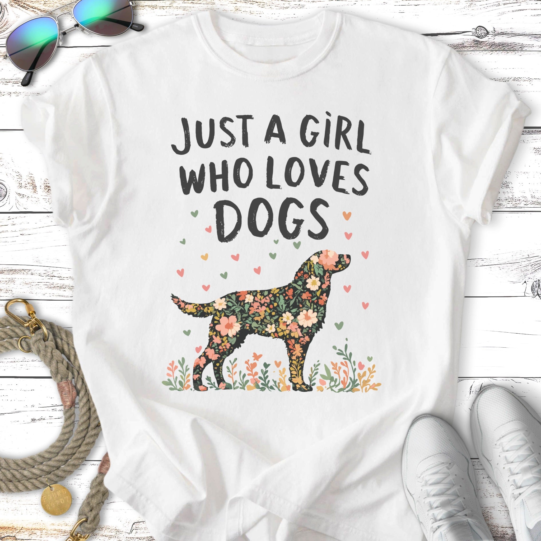 White t-shirt with "Just a girl who loves dogs" and floral dog graphic.