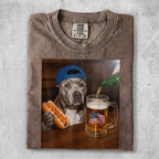 Pit bull in cap holds hot dog, mug of beer with American flag foam.