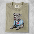 Gray Pitbull wearing a blue "I ❤️ MOM" shirt.