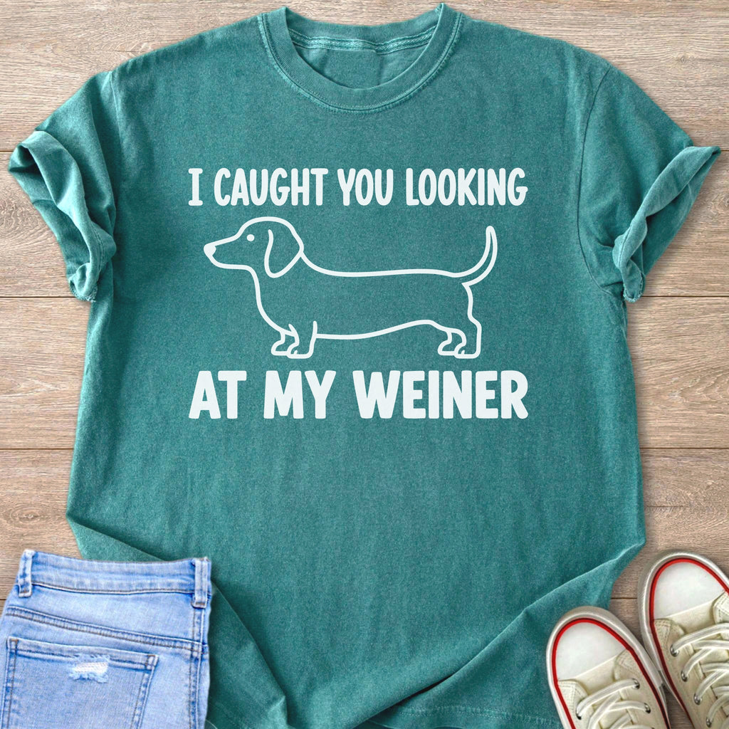 Teal t-shirt with white dachshund graphic and text "I CAUGHT YOU LOOKING AT MY WEINER".