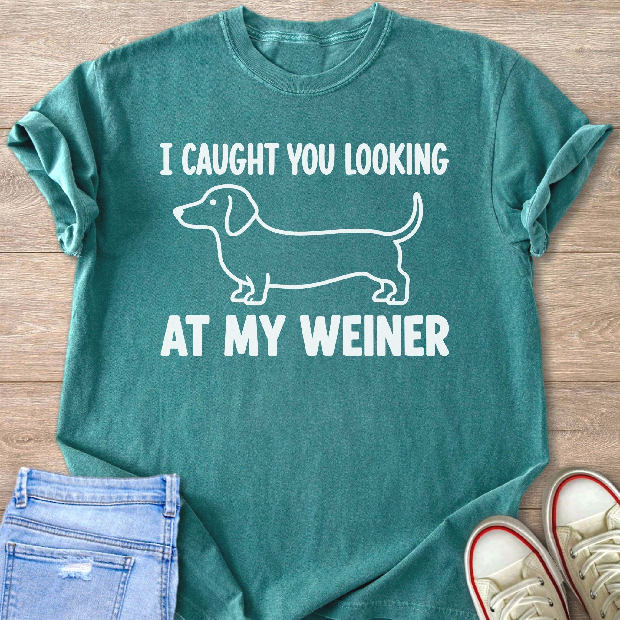 Teal t-shirt with white dachshund graphic and text "I CAUGHT YOU LOOKING AT MY WEINER".