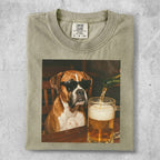 Boxer dog wearing sunglasses pours beer in a mug.