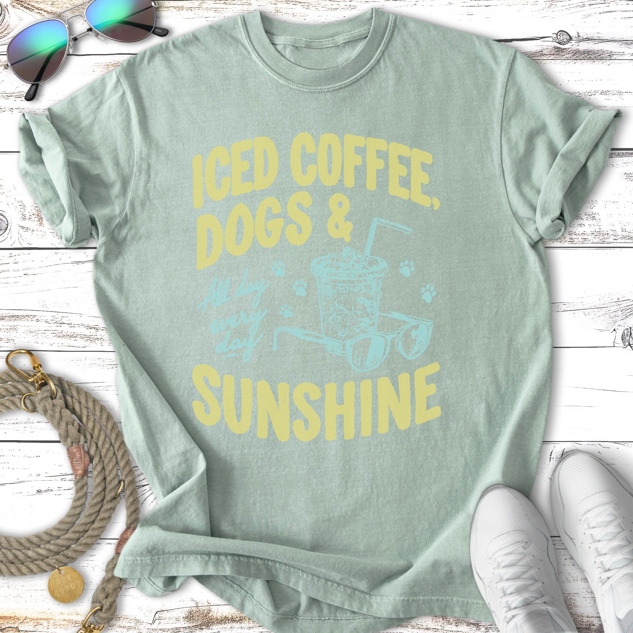 Light green t-shirt with "Iced Coffee, Dogs & Sunshine" in yellow text.
