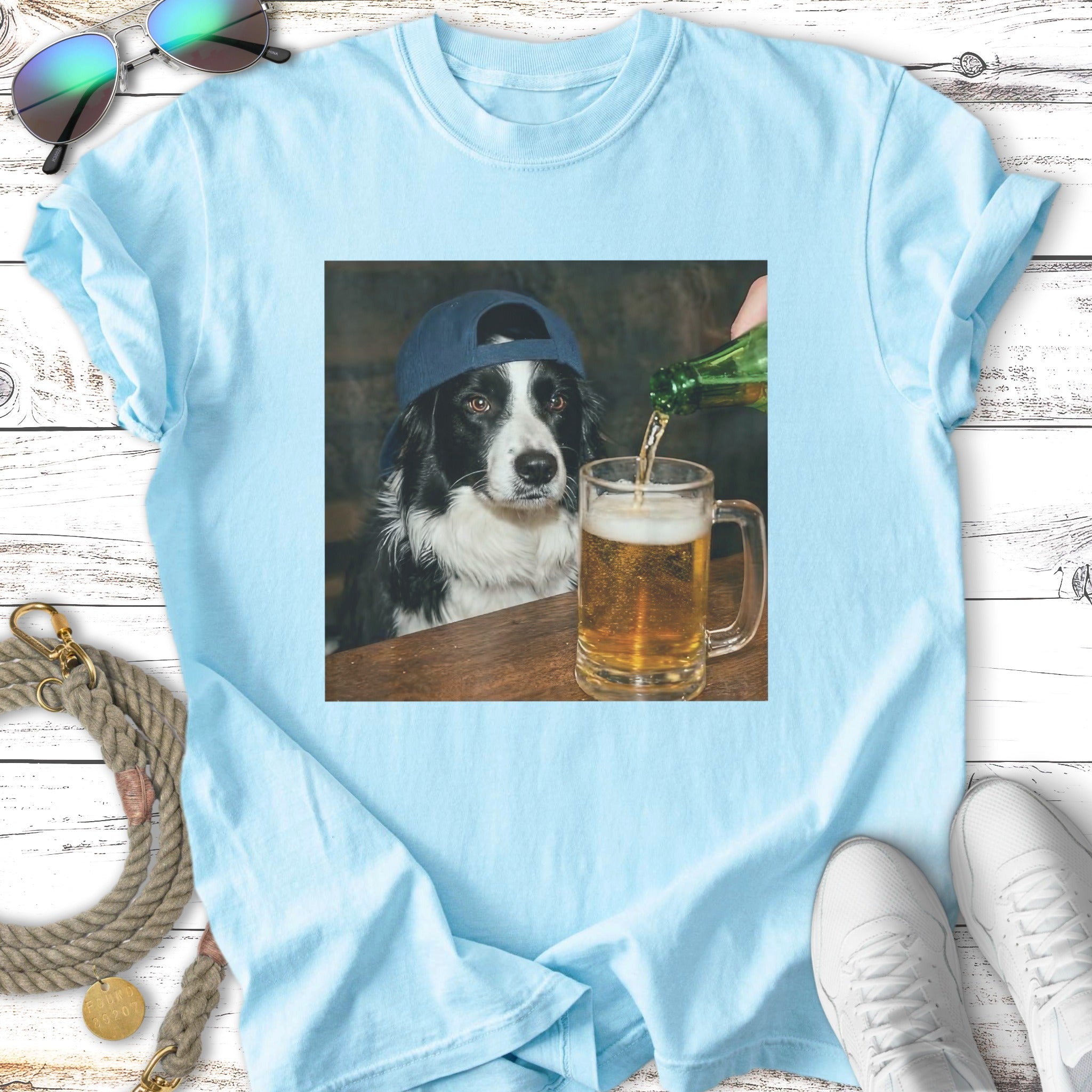 Border collie dog wearing a baseball cap pours beer into a mug.