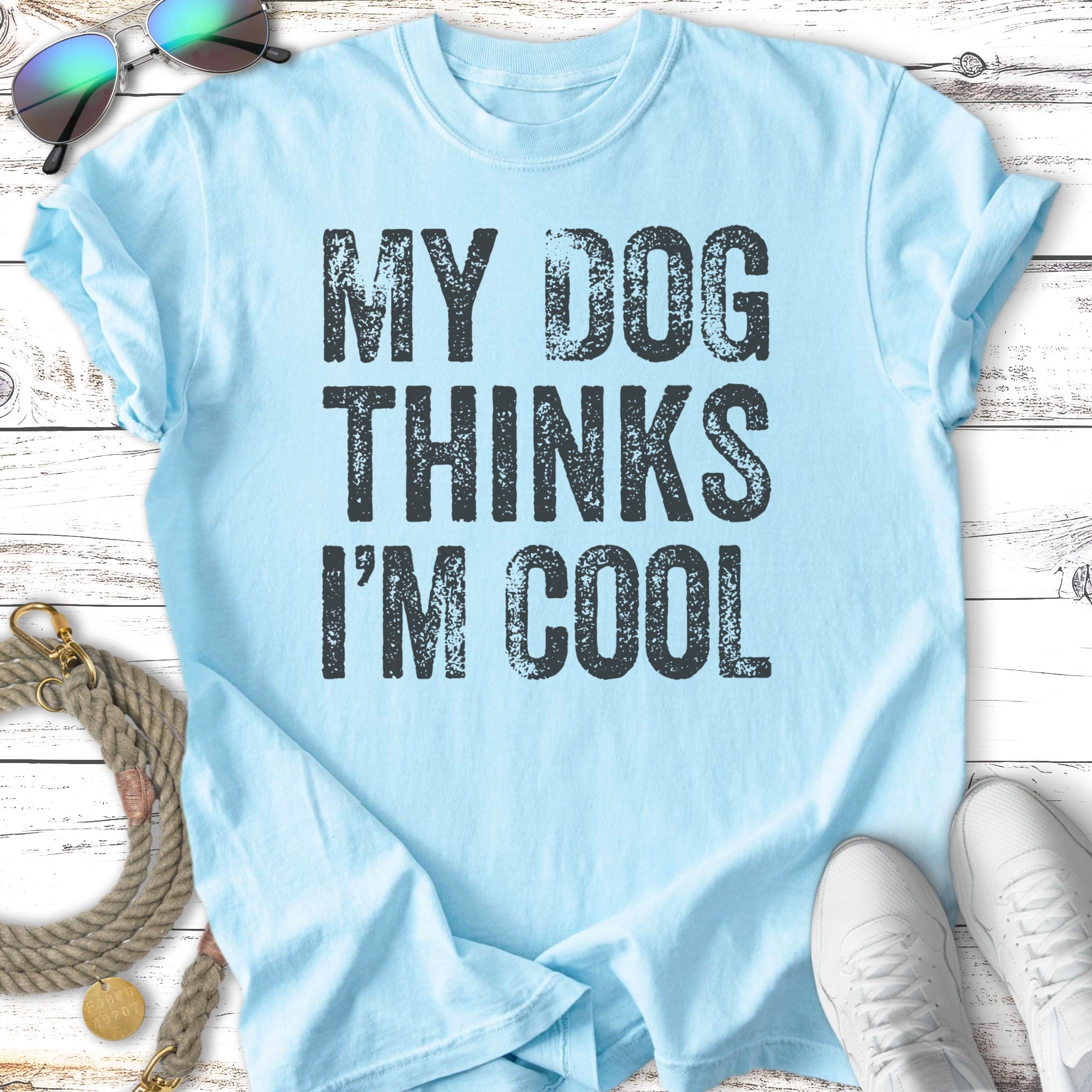 Light blue t-shirt with black text that says "MY DOG THINKS I'M COOL."
