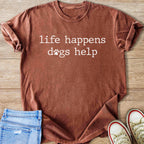 Brown t-shirt with white text "life happens dogs help" and a paw print.