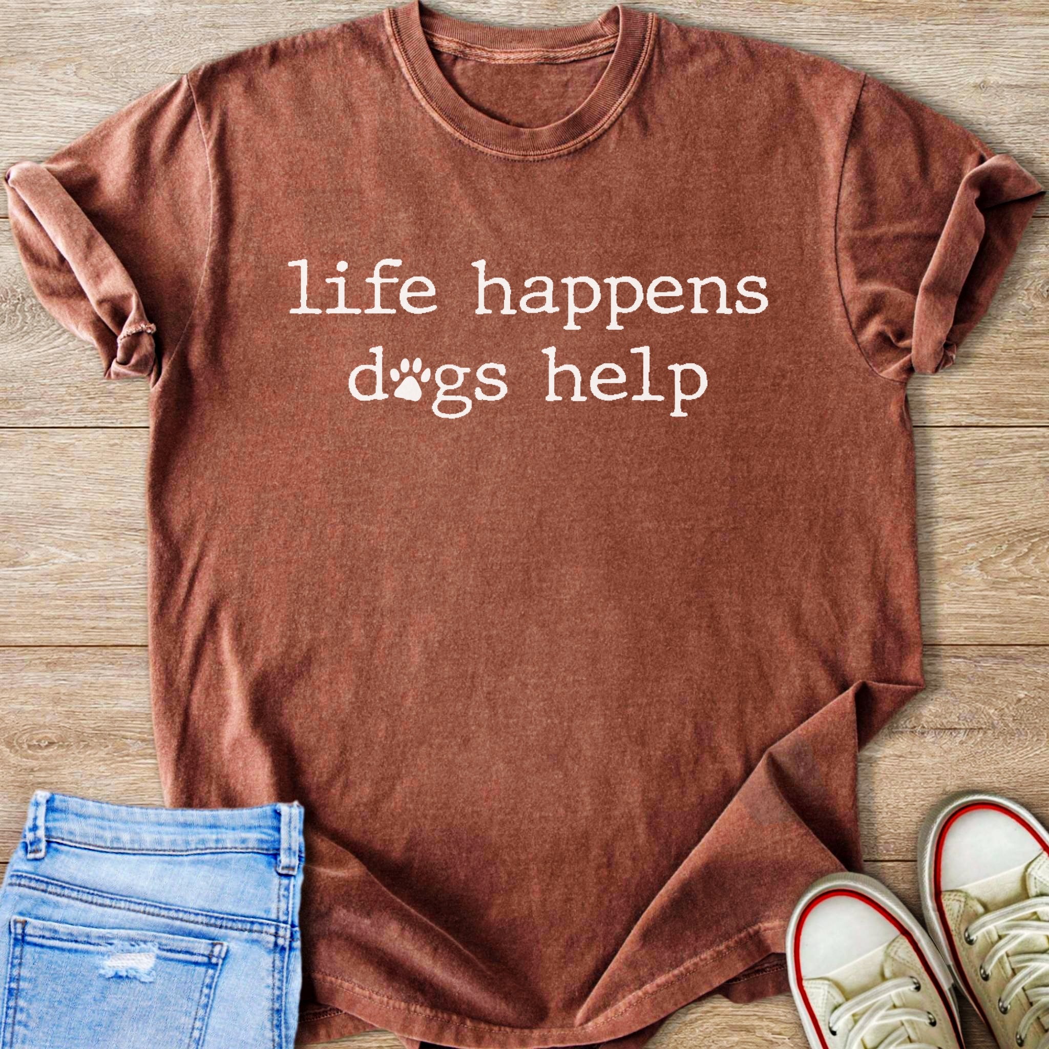 Brown t-shirt with white text "life happens dogs help" and a paw print.