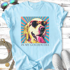 Golden retriever wearing sunglasses, tongue out, with text "IN MY GOLDEN ERA".