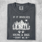 T-shirt with mountains, trees, sun, and "IF IT INVOLVES HIKING & DOGS -COUNT ME IN-" text.