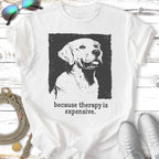 T-shirt with black and white graphic of a golden retriever and text "because therapy is expensive".