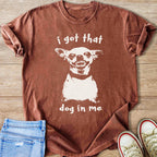 Brown t-shirt with white graphic of a dog and text "i got that dog in me"