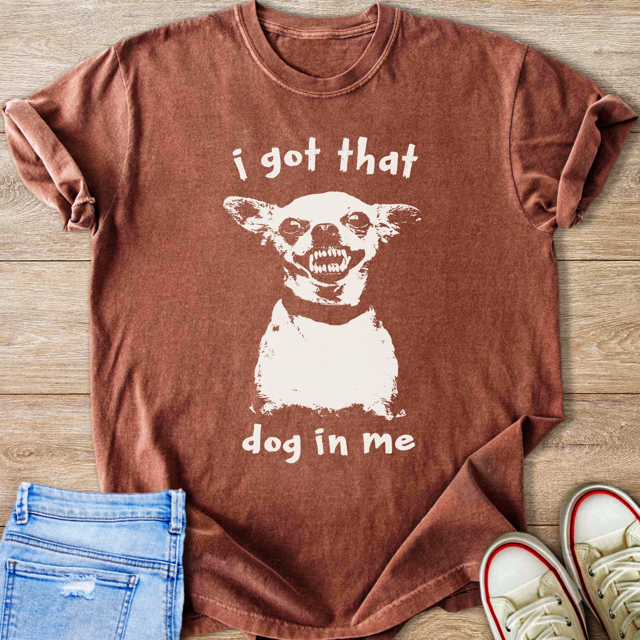Brown t-shirt with white graphic of a dog and text "i got that dog in me"