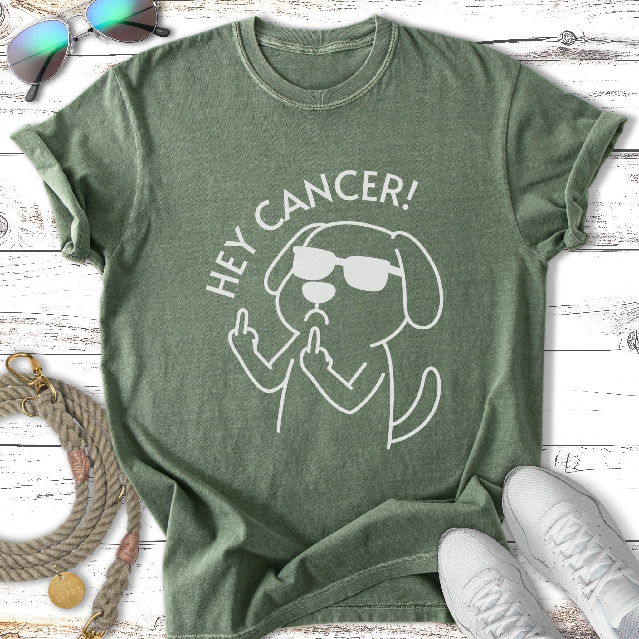 Green t-shirt with "Hey Cancer!" and a cartoon dog flipping the bird.