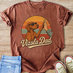 Vizsla dog wearing sunglasses gives a high-five with text "Vizsla Dad".