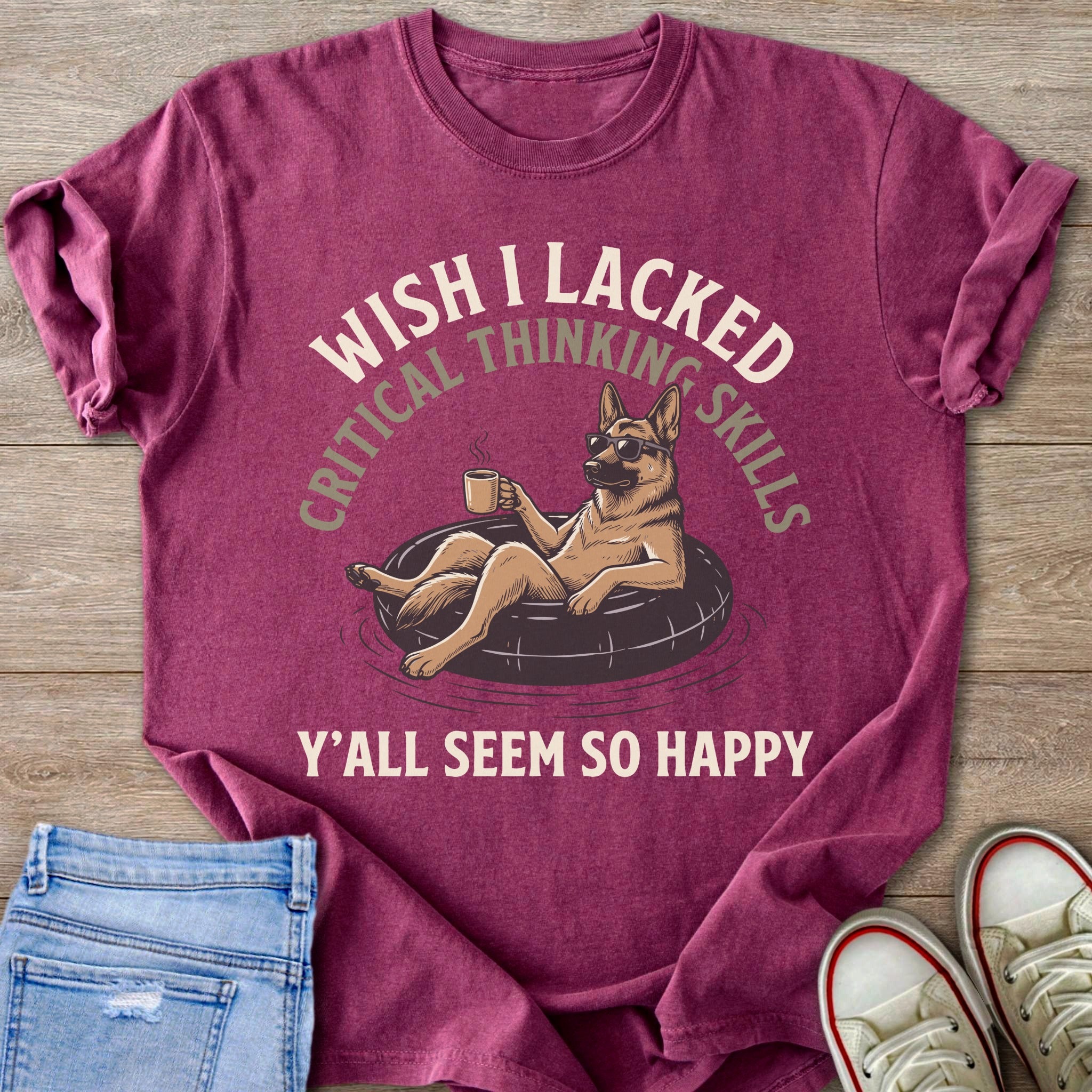 German Shepherd in inner tube with sunglasses, holding coffee cup, text reads "Wish I lacked critical thinking skills, Y'all seem so happy".